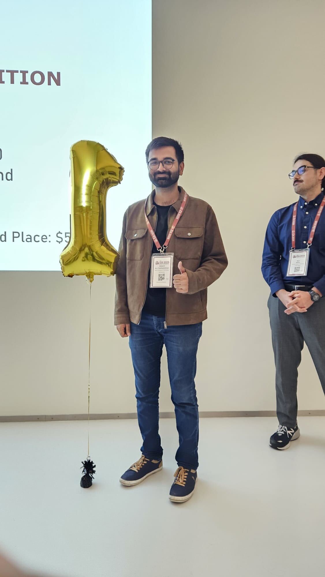 Anand Radhakrishnan winning the best student pitch competition award.